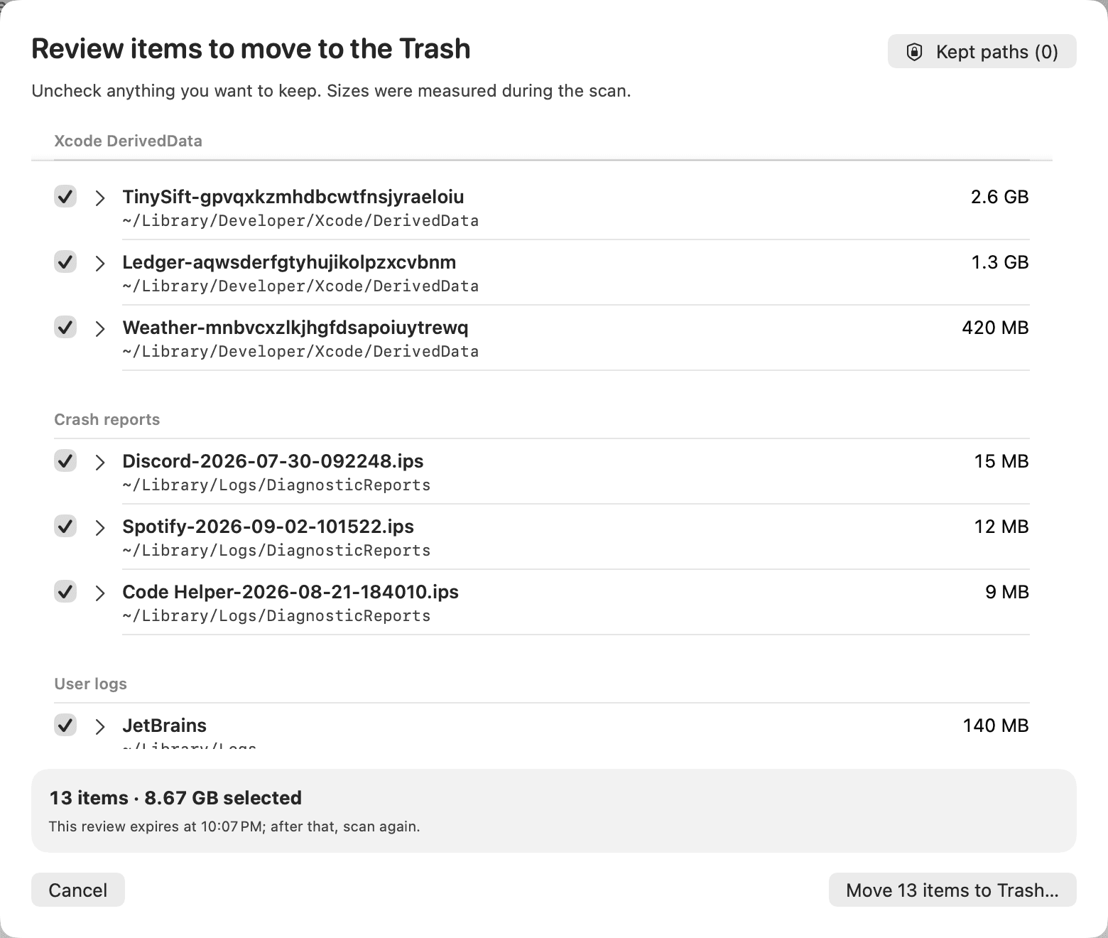 The review sheet: thirteen paths with their sizes, 8.67 GB in total, and a button to move them to the Trash.